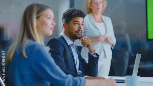Fotografía Diverse business professionals attending a corporate meeting in a modern office,