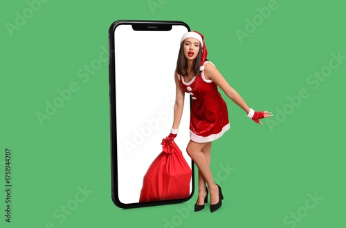 Sexy young woman in Santa c...