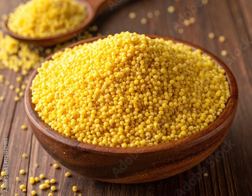 Proso Millet (Chena - Barri), also called broom corn millet, in a wooden Bowl