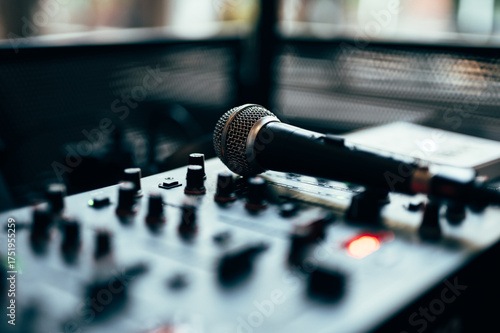 Professional microphone on DJ mixer sound equipment audio recording studio music production broadcasting console control