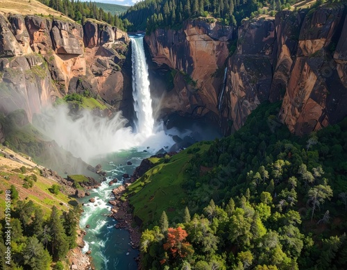 Majestic Waterfall Cascading Through a Rugged Canyon Surrounded by Lush Green Forest.