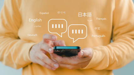 Person using smartphone with multilingual chat icons, representing global communication, language translation, online messaging, and international connection through modern mobile technology.
