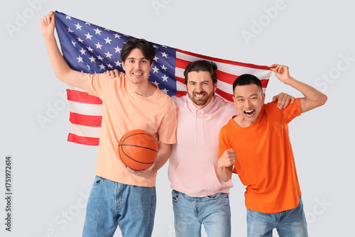 Male sports fans with ball ...