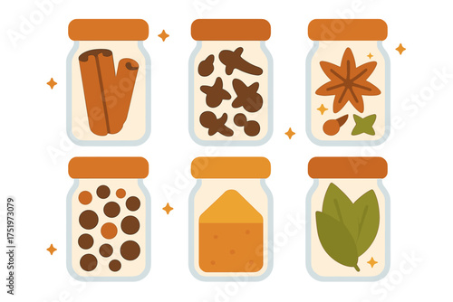 Dried culinary spices assortment stored in clear glass jars with orange lids