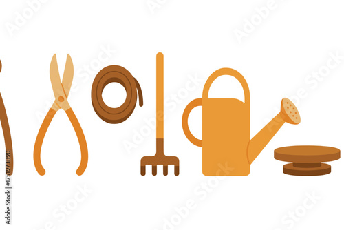 Row of essential gardening tools including pruning shears, hand rake, and watering can