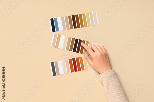 Woman pointing at color pal...