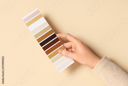 Female hand with color pale...