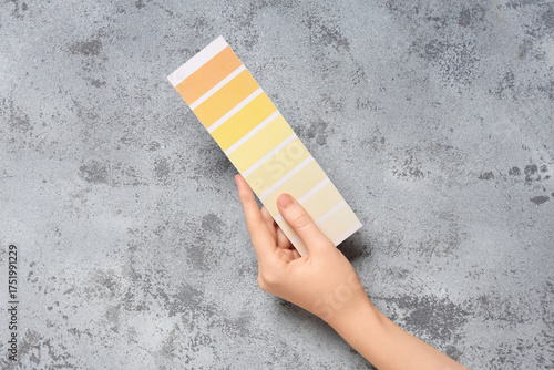 Female hand with color pale...