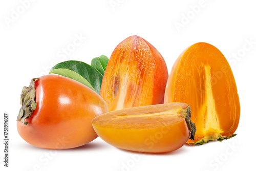 A whole and sliced persimmons against a white backdrop, showcasing the glossy orange skin and vibrant interior flesh, accented with green leaves.