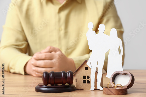 Man with judge's gavel, hou...