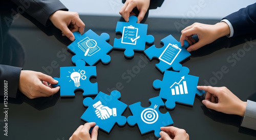 Hands assemble jigsaw puzzle pieces representing business functions, symbolizing teamwork and strategic partnerships for collective success and growth.