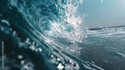 Immersive Close-Up of a Powerful Ocean Wave Barrel with Sunlit Spray and Distant Shoreline