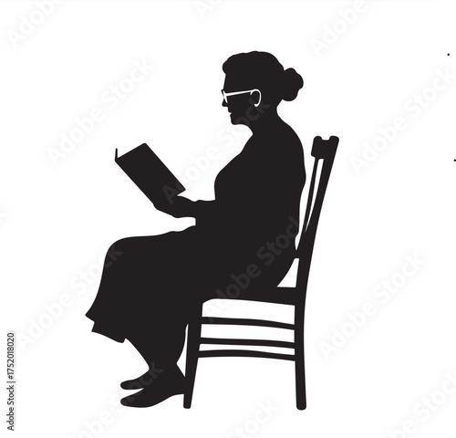 silhouette of a woman reading a book