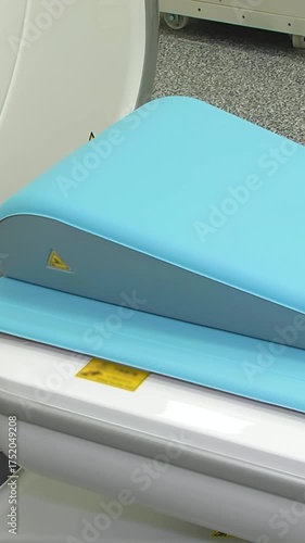 Computed axial tomography (CAT). CT scanner. Medical examination using a modern CT scanner in a modern hospital - Vertical video.