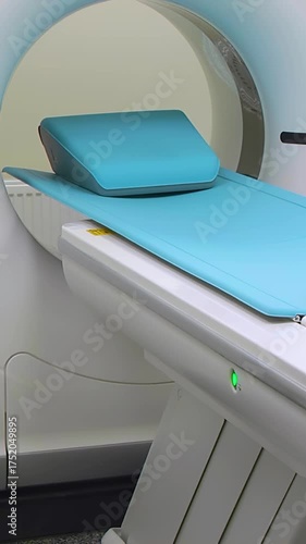 Computed axial tomography (CAT). CT scanner. Medical examination using a modern CT scanner in a modern hospital - Vertical video.
