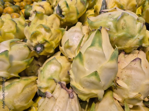 Fresh yellowish white dragon fruit neatly arranged