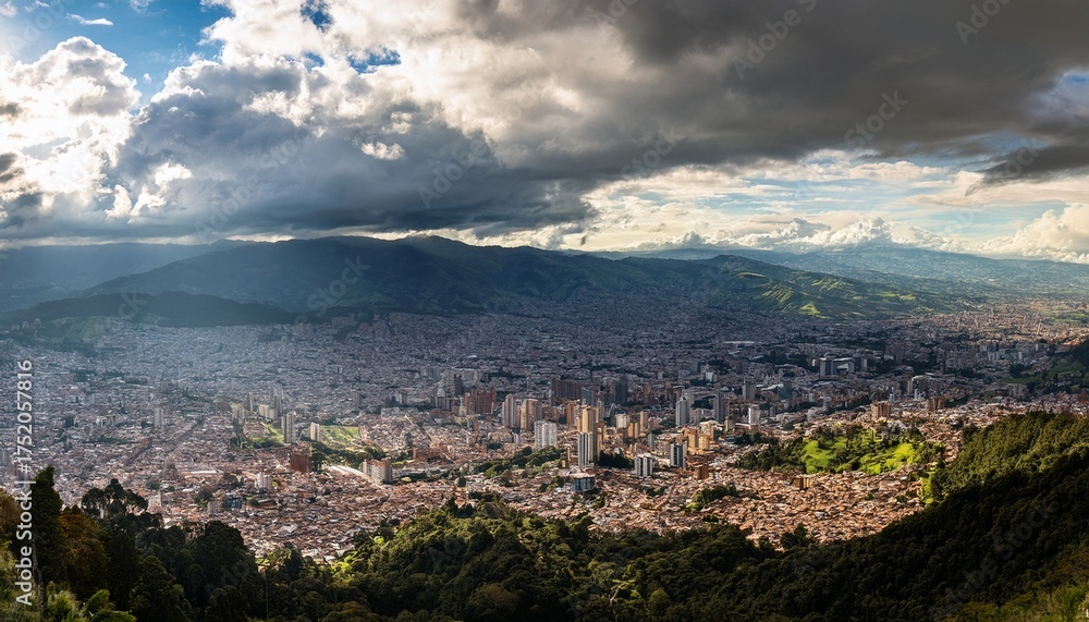 Obraz premium panorama of the high plateau with the colombian capital bogota with dramatic cloudy sky and sunlight
