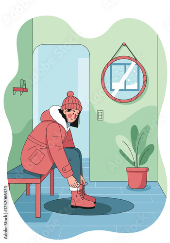Woman fastening winter boots while sitting in an entryway with a cozy atmosphere