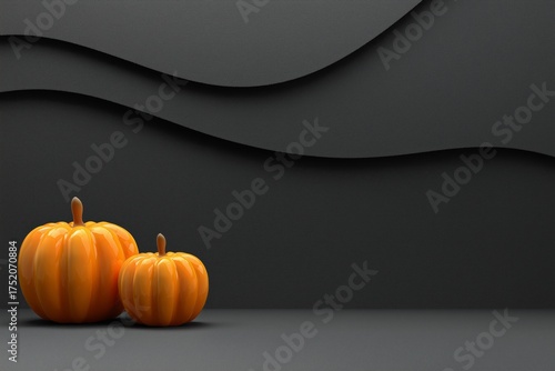 A vibrant display of two glossy orange pumpkins set against a minimalist dark backdrop, highlighting their shape and color.
