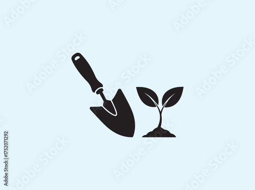 Eco Symbol of Trowel and Leaf Silhouette Isolated on Clean White Background for Environmental Themes
