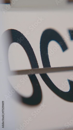 Close-up shot of month field on a flip calendar rapidly changing