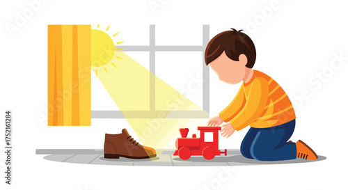 A young boy plays with a toy train near a window on a sunny day