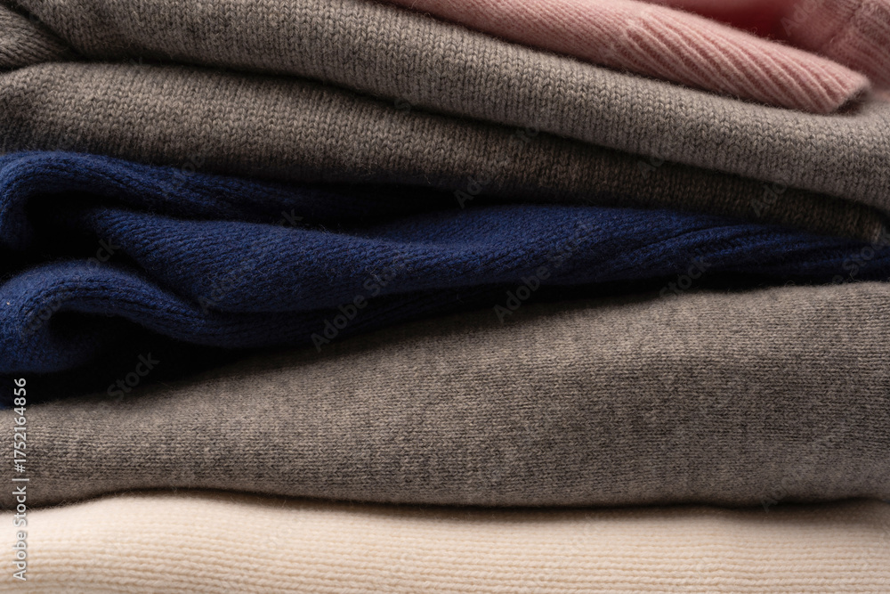 Fototapeta premium A group of warm sweaters isolated on a white background.