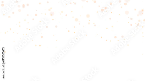 Sparkling gold particles create a shimmering bokeh effect on dark background. Golden abstract transparent overlay effect. Defocused light blur.