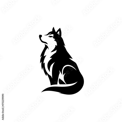 A striking silhouette of a wolf sitting upright with its head held high