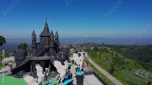 Mysterious Dark Castle on a Hilltop Overlooking a Scenic Landscape.