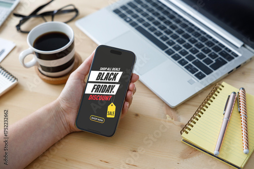 Woman shopping from Black Friday sale. Mobile application for online shopping Black Friday