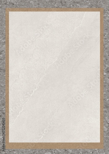 A blank sheet of textured paper framed by a wooden border on a gray surface