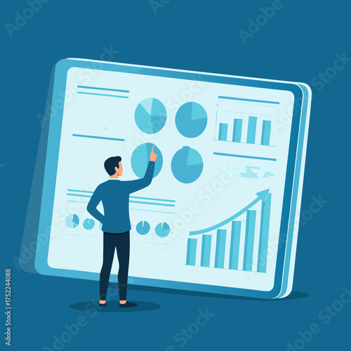 Businessman in a blue sweater analyzing data on a large digital screen with pie charts and bar graphs.