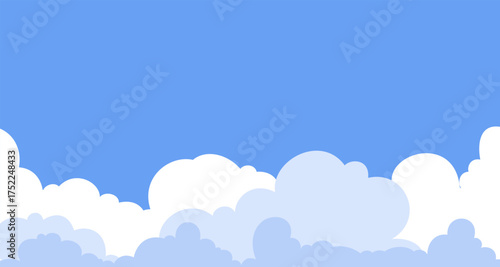 Cartoon blue sky with a fluffy cloud landscape at the bottom. A simple and cute background template providing a peaceful scene with ample copy space.