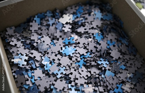 Many Puzzle Pieces On The Table For Assembly