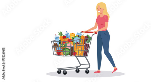 A blonde woman happily pushing a shopping cart overflowing with groceries.