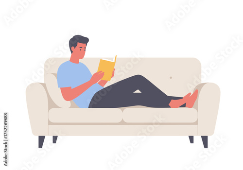 A man reclines on a sofa, engrossed in reading a book, enjoying leisure time.