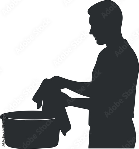 Silhouette of a man washing clothes in a bowl representing household chores and laundry tasks.
