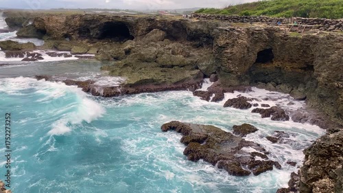 Animal Flower Cave and cliffs at North Point, St. Lucy, Barbados. Cave and cliffs with a coral floor that opens directly into Atlantic Ocean. Waves beating into the rock. 