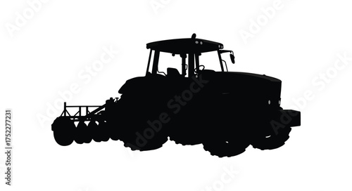 A striking black silhouette of a modern agricultural combine harvester machine
