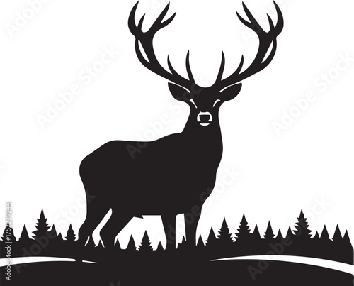 Majestic stag with large antlers standing in a silhouette forest landscape proud wild animal