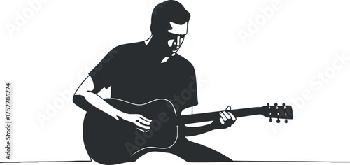 A silhouette of a musician passionately playing an acoustic guitar in a creative setting.