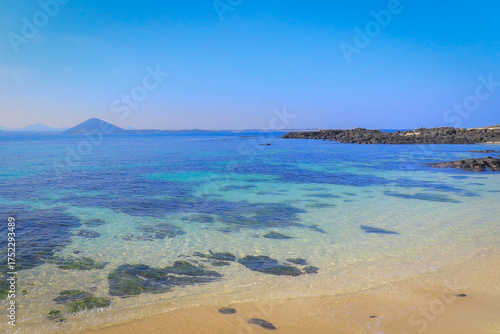 Scenic Coastal View of Seongsan Ilchulbong and the Beach in Jeju Island, South Korea