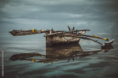An abandoned ship stands aground. A heavenly landscape. A wooden ship. Beautiful nature. Blue sky.