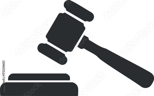 A black silhouette of a gavel symbolizing justice and legal authority in a courtroom setting.