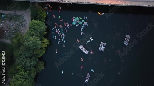 The footage begins tight on colorful kayaks and paddleboards peacefully floating on the Colorado River (Lady Bird Lake) Austin texas usa 4k