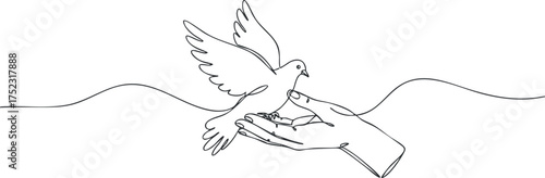 A gentle hand releasing a bird symbolizing freedom and hope in nature.