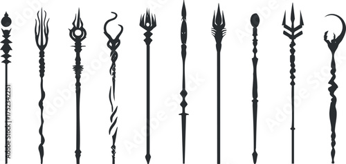 Silhouette collection of fantasy staffs with various ornate designs on a white background.