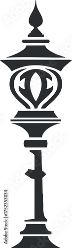 Silhouette of a vintage ornamental street lamp with intricate design elements in black.