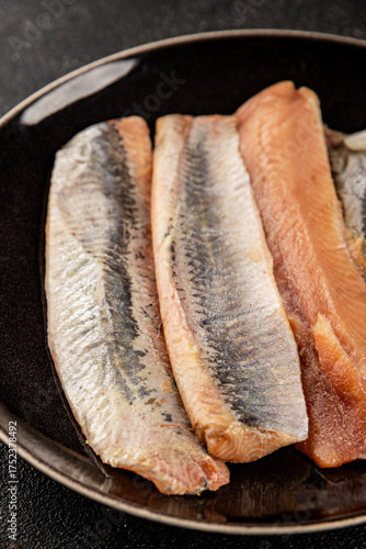 Herring fillet fish fresh seafood portion size natural product tasty snack fresh delicious gourmet food background on the table rustic top view copy space pescetarian diet